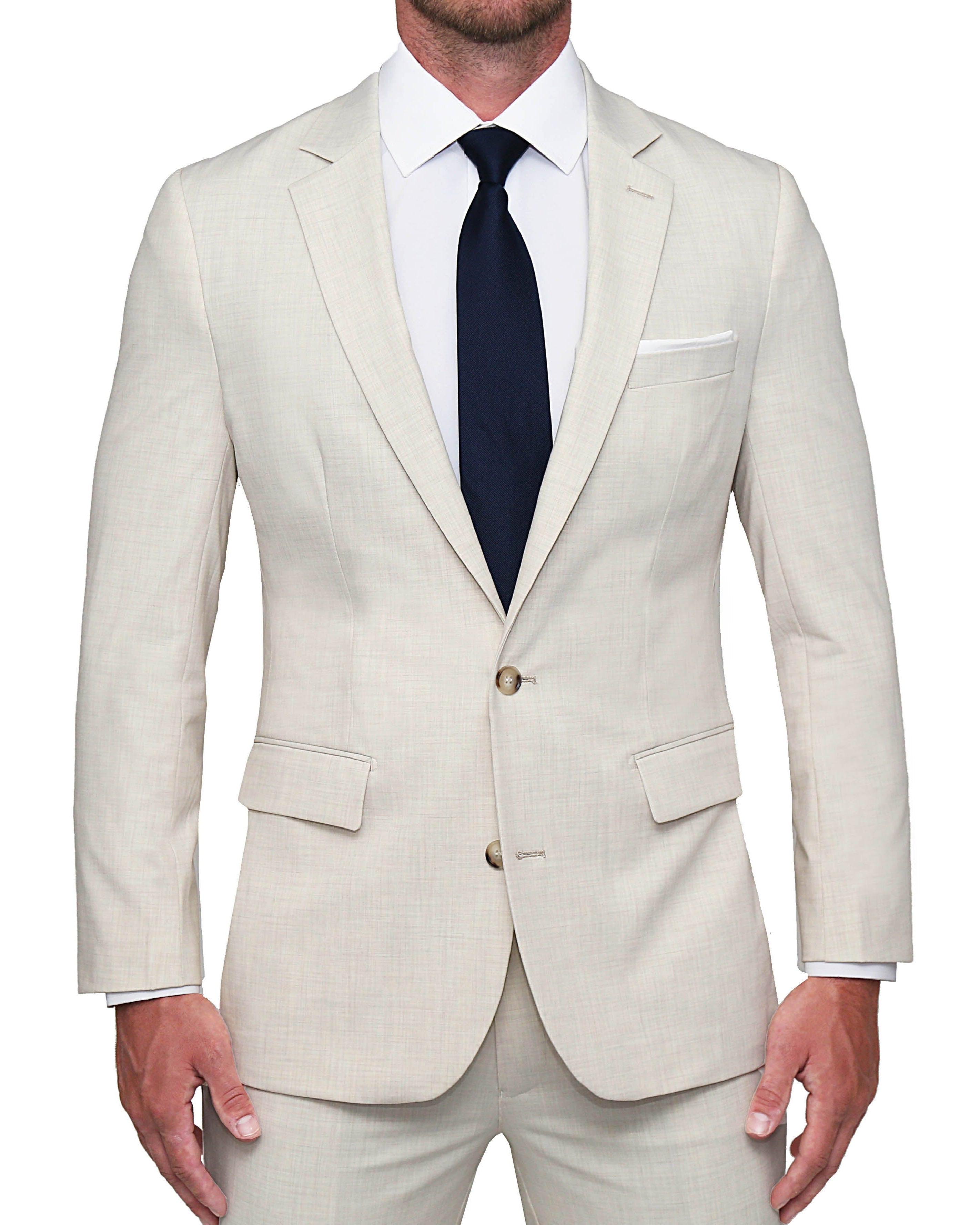 A man wearing a beige Athletic Fit Stretch Blazer with a white dress shirt and a dark tie.