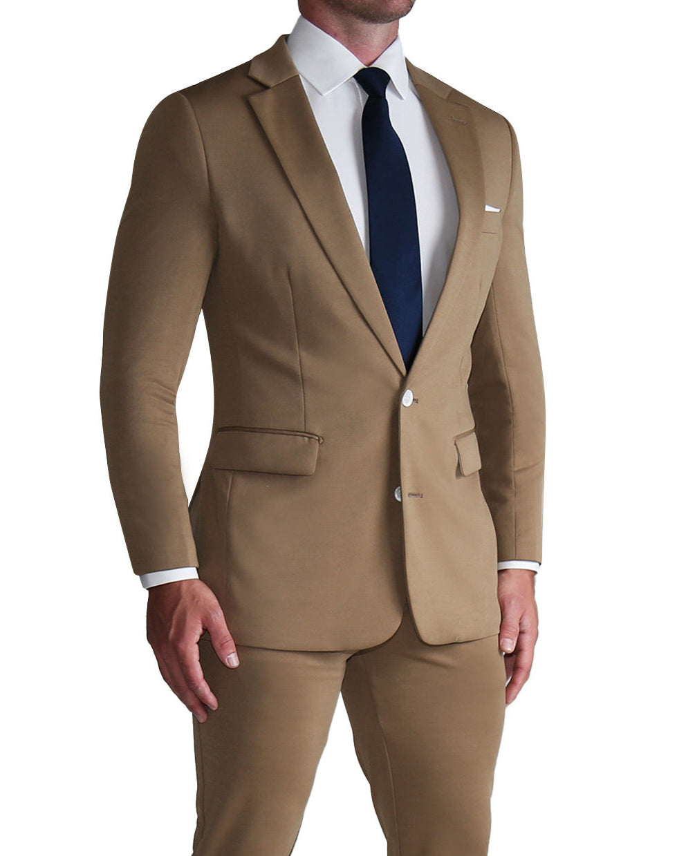 A man wearing a solid dark tan athletic fit stretch suit with a white shirt and blue tie.