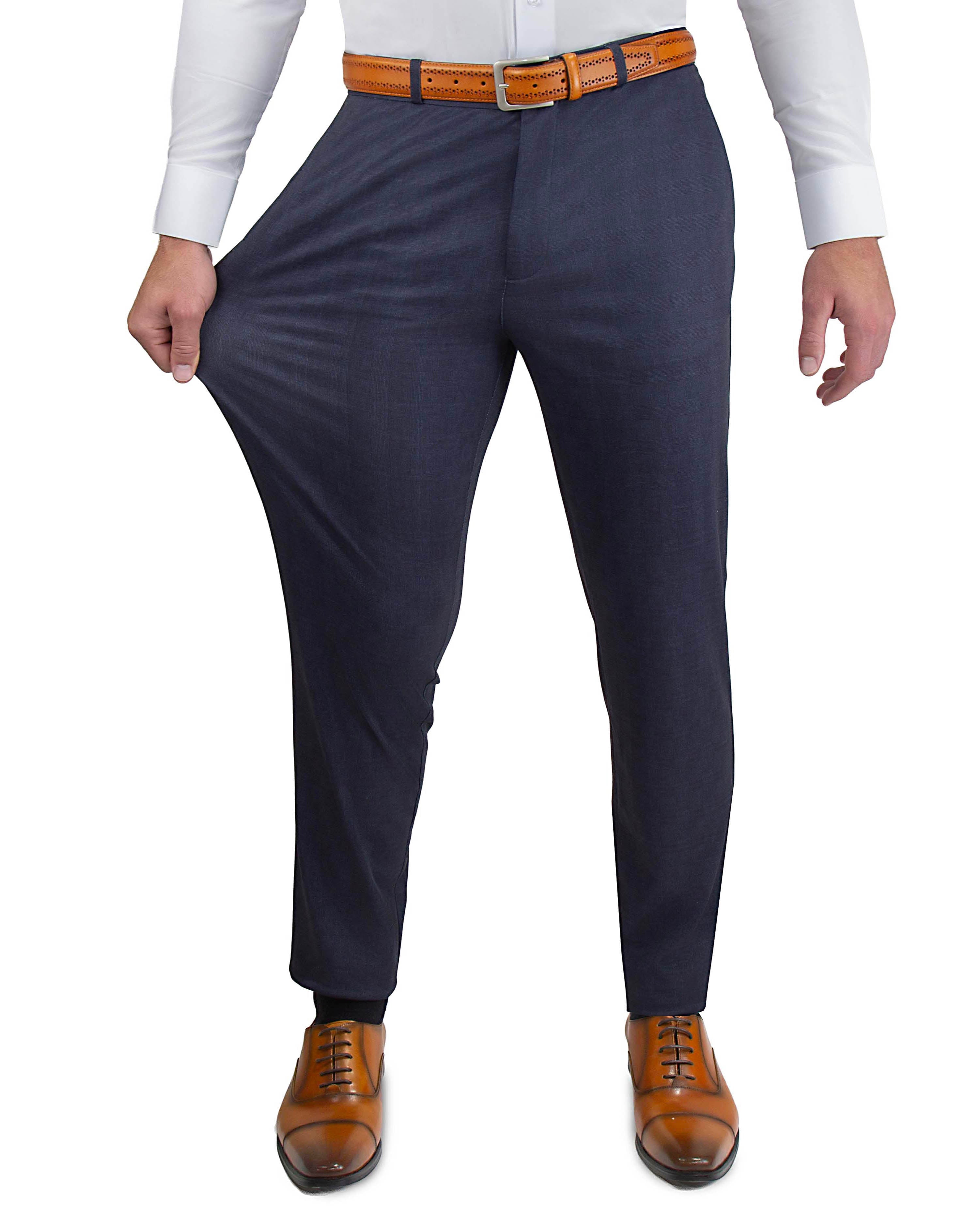 Navy pants with a white shirt and brown shoes on a white background