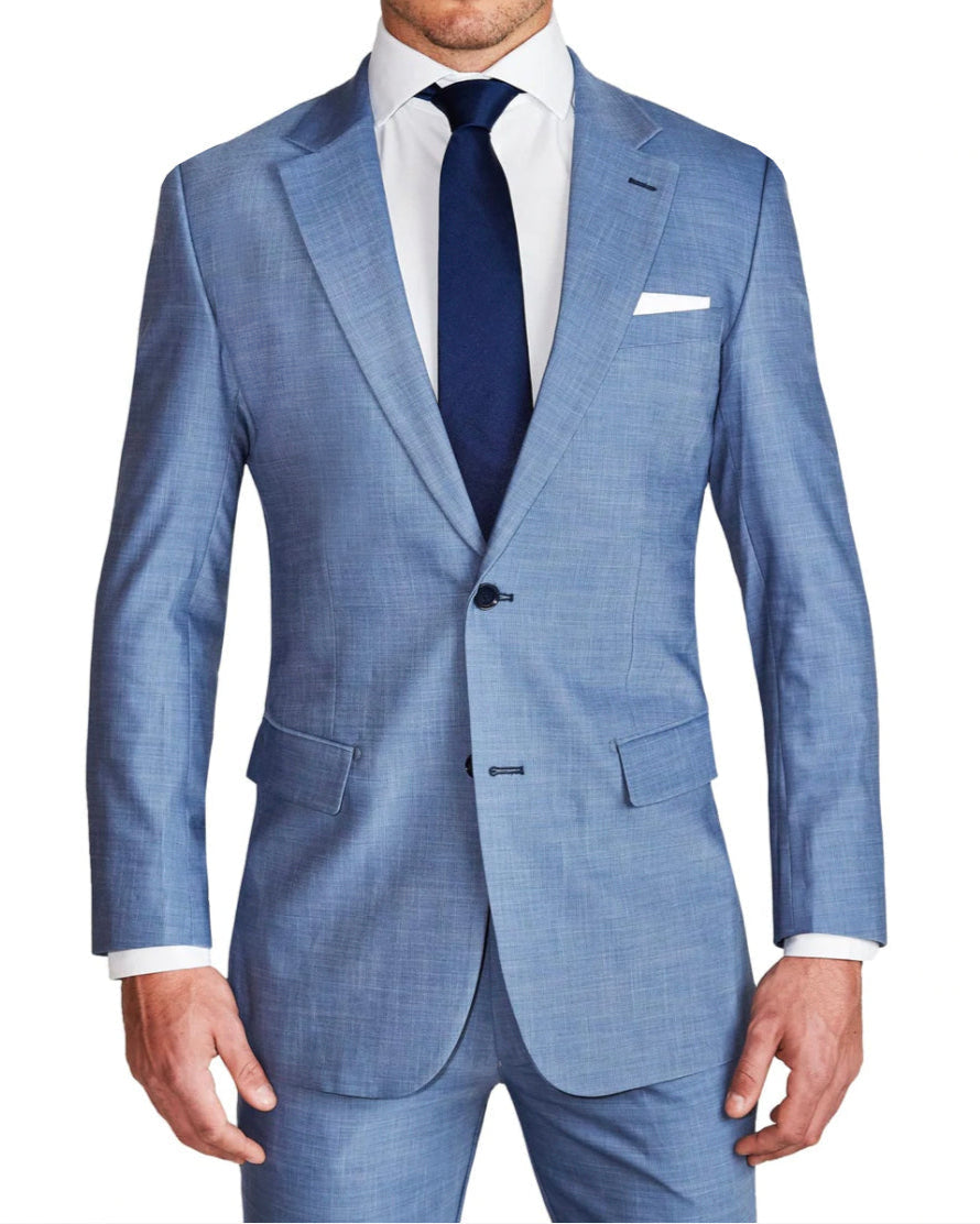 A light blue, single-breasted, two-button blazer with medium notch lapels, navy buttons, and a double vent. It is modeled by a person wearing a white dress shirt and a navy tie.