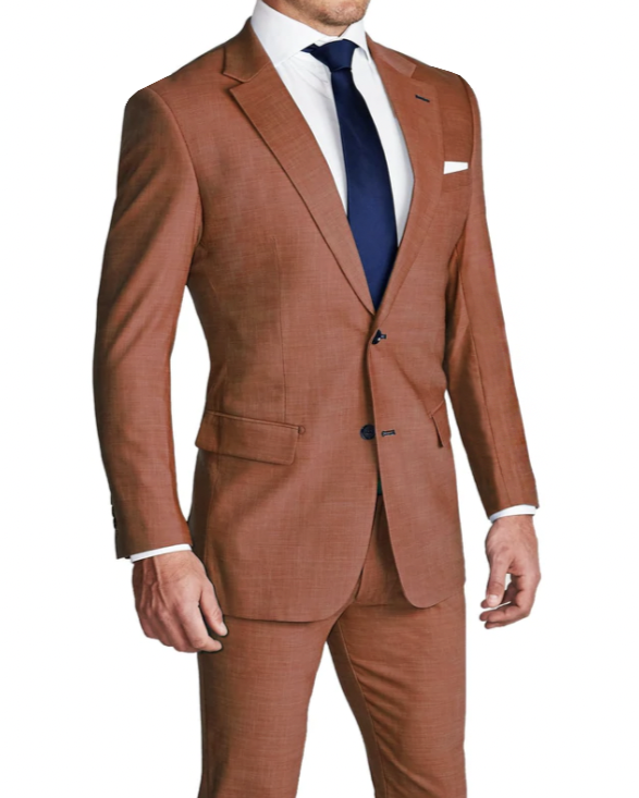 A man wearing a heathered burnt orange two-piece suit with a blazer and trousers, paired with a white shirt and a blue tie.