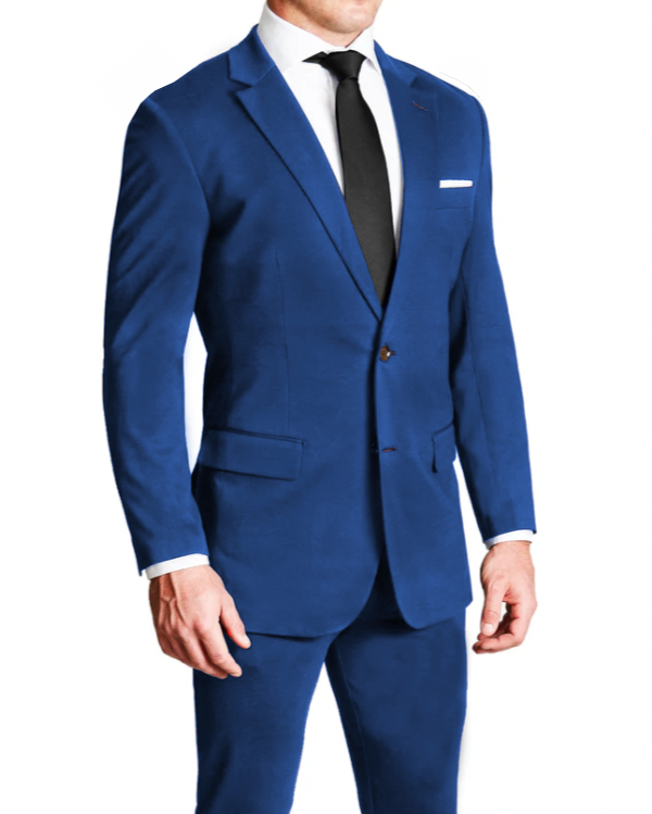 A man wearing a solid royal blue two-piece suit with a blazer and trousers, featuring a two-button single-breasted blazer with medium peak lapels and brown buttons, and the trousers with a hidden soft-stitched hemline.